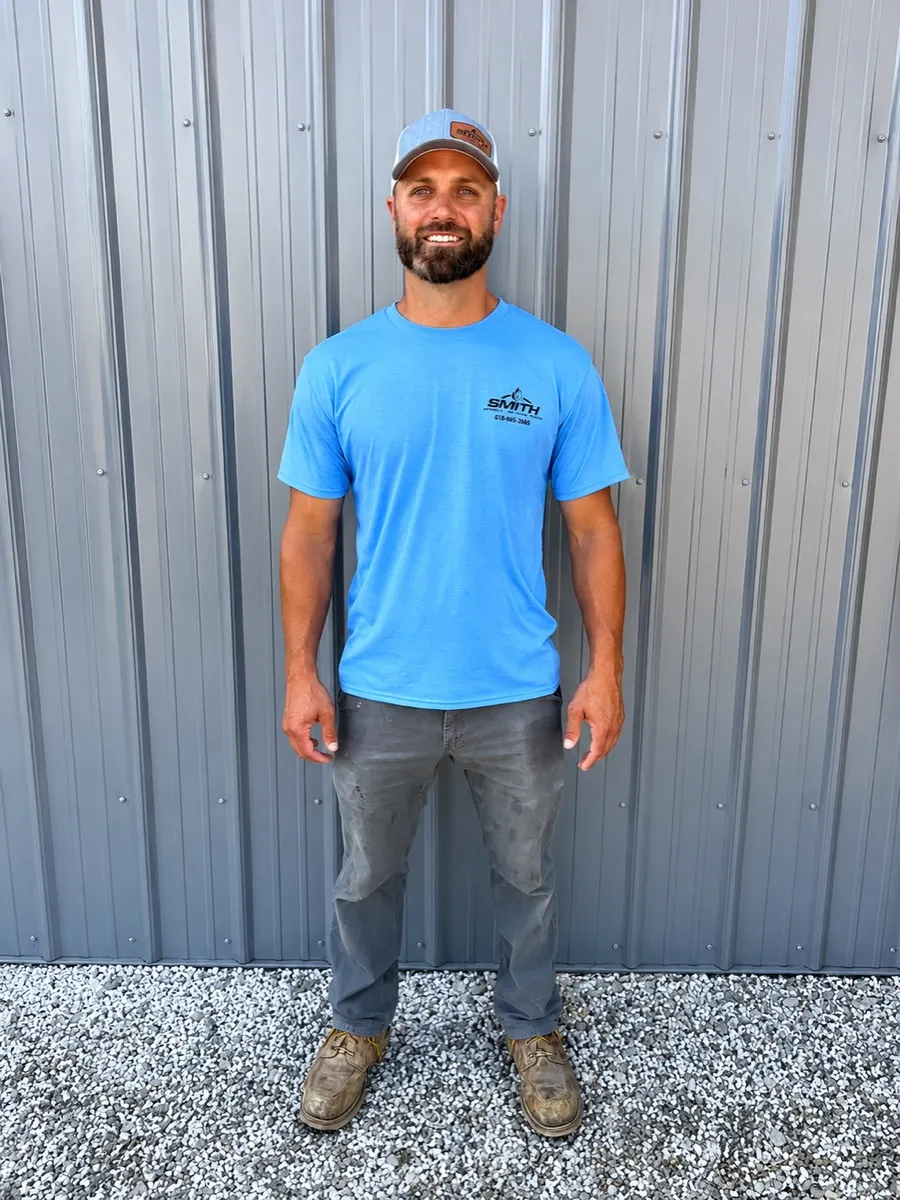 Smith technician checking HVAC equipment before a service visit