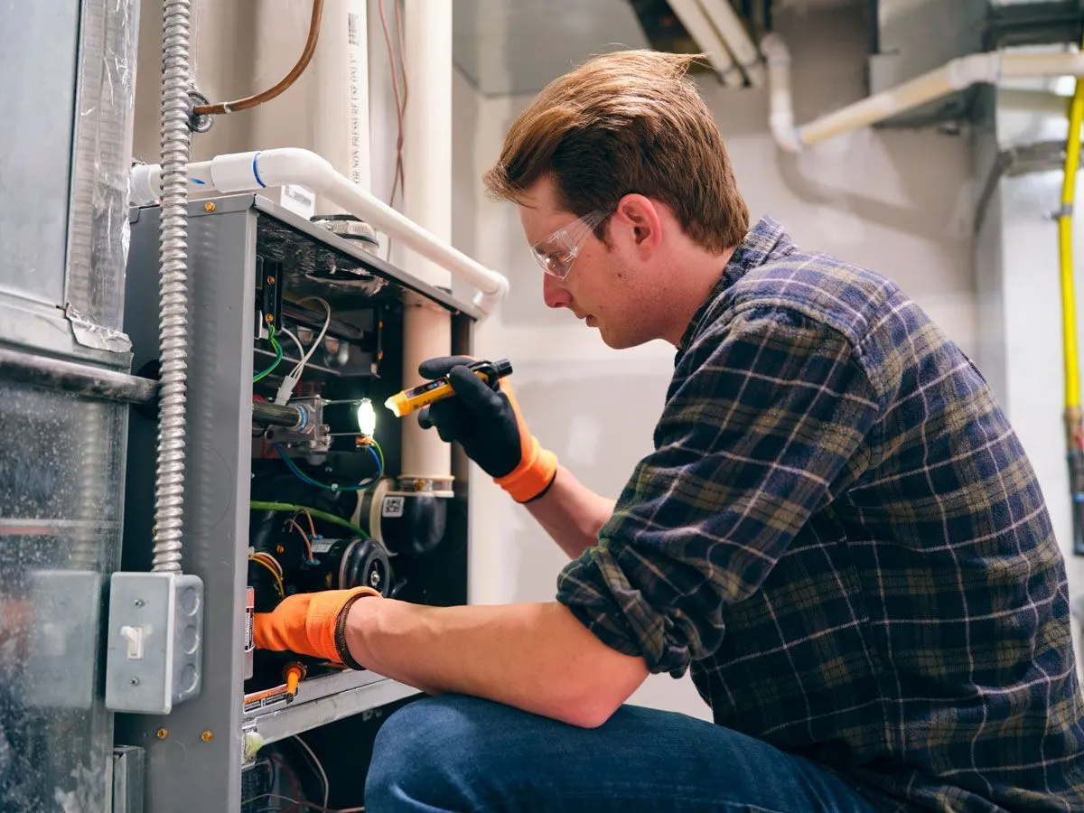 Smith Heating technician serving a local neighborhood — HVAC service area: Chester, IL