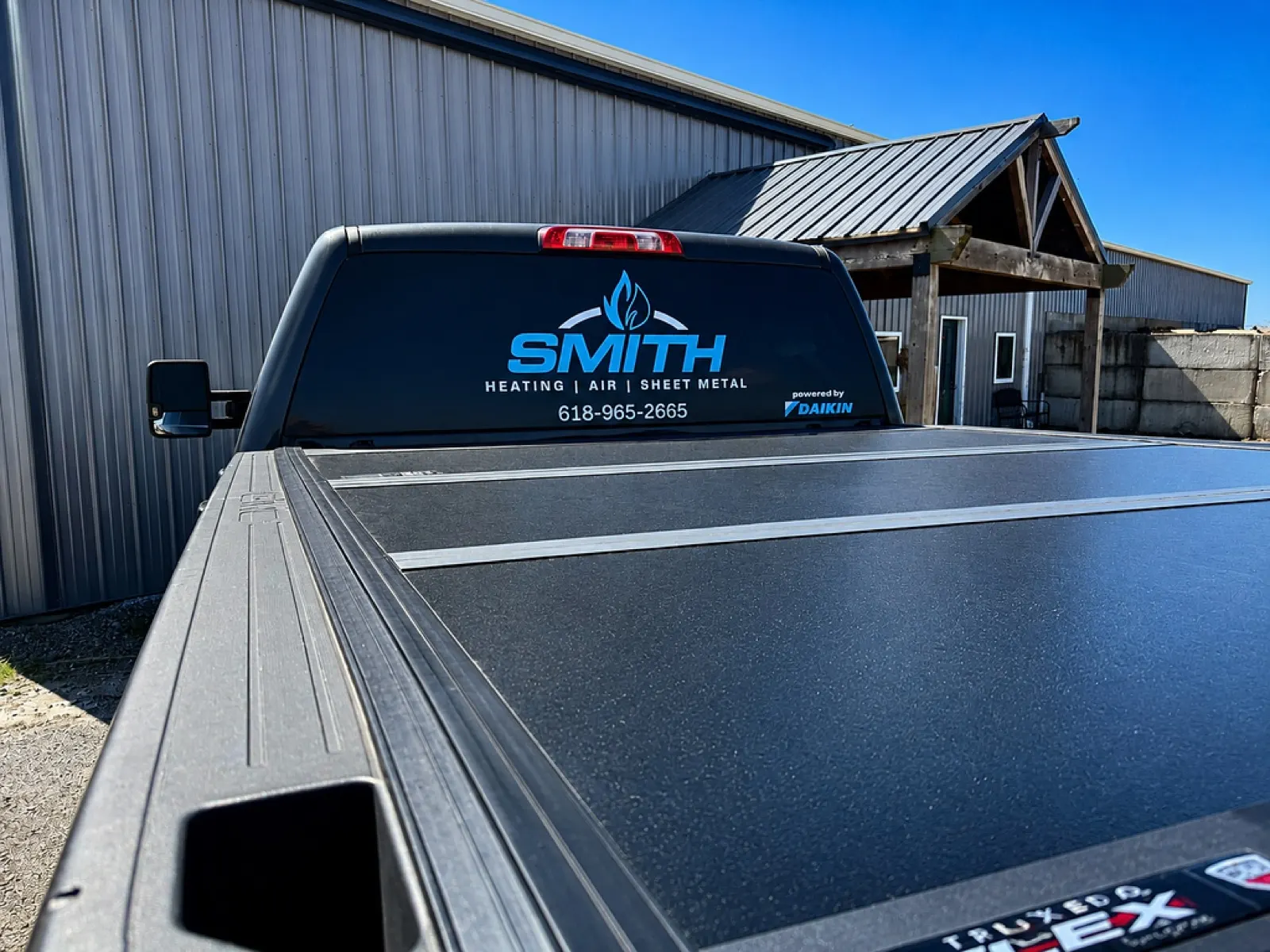 Smith Heating service truck with Powered by Daikin branding